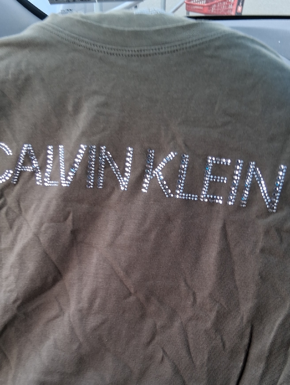Calvin Klein Olive Green Tee with Rhinestone Logo.